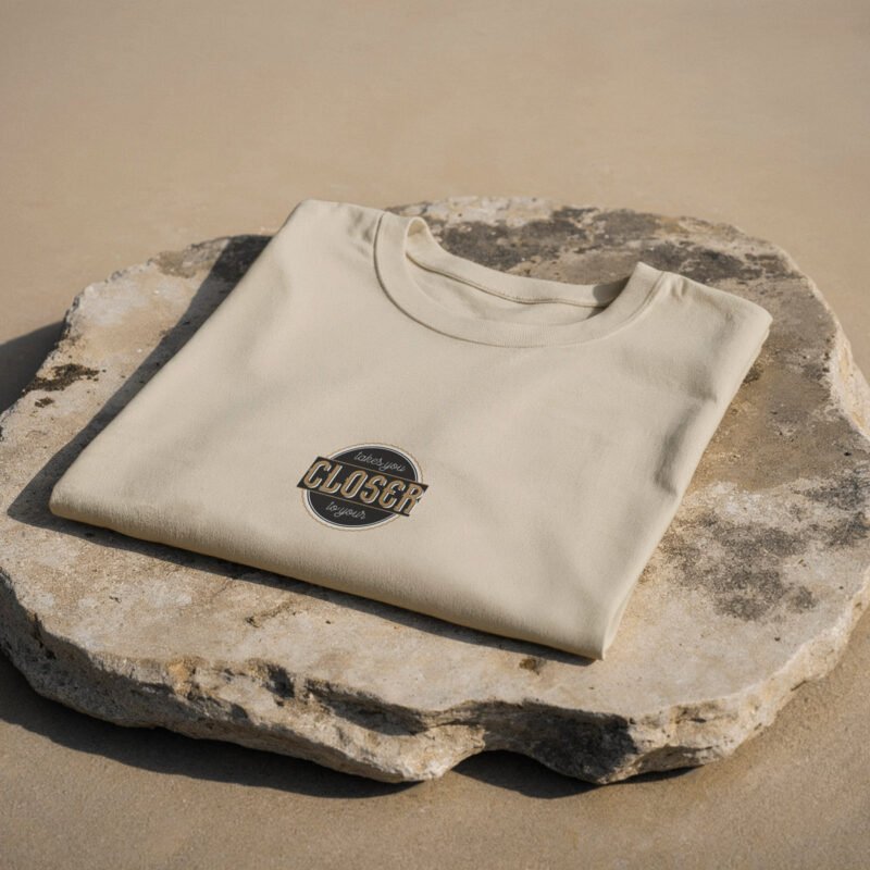 BOLD GFX Apparel Series – High-Fidelity Sand-Colored Tee with Vintage Badge Art